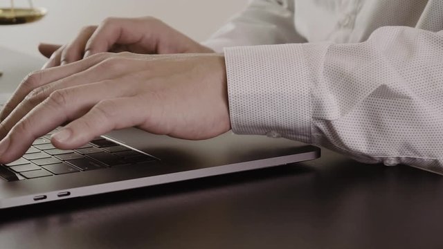Lawyer working with new modern computer in office in slow motion