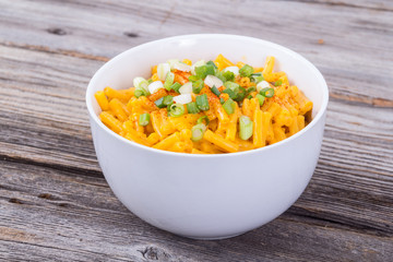 mac and cheese bowl on rustic table