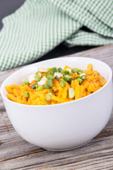 mac and cheese bowl on rustic table