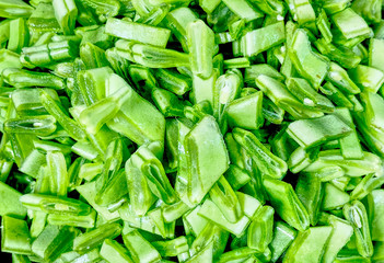 Close up of slices of green Italian taccola, a kind of pea (Pisum sativum) uncooked. Suitable to be used like a background.