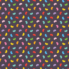 Colorful jelly beans candies seamless pattern on dark background.