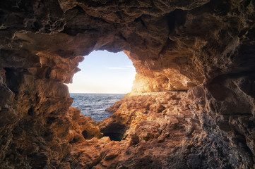 Cave in rock at the sea. Nature composition.