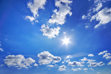 Deep blue sky with clouds at sunny day.