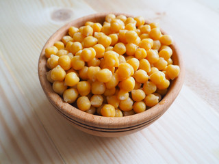 Chickpeas served in a wooden dish
