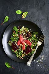 Delicious sald with chard leaves, beetroot and grapefruit slices.Top view.