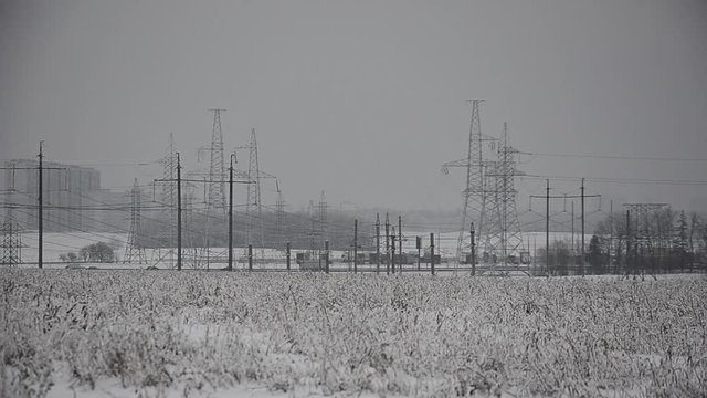Power lines in the snow. Cogeneration plant in a strong blizzard