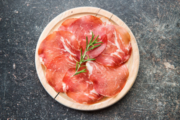 Sliced prosciutto crudo.