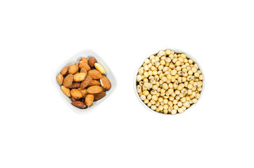 Almond nut and soy bean in white bowl isolated on white background
