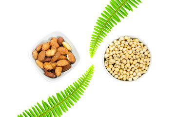 Almond nut and soy bean in white bowl isolated on white background