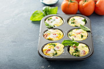 Healthy egg muffins, mini frittatas with tomatoes