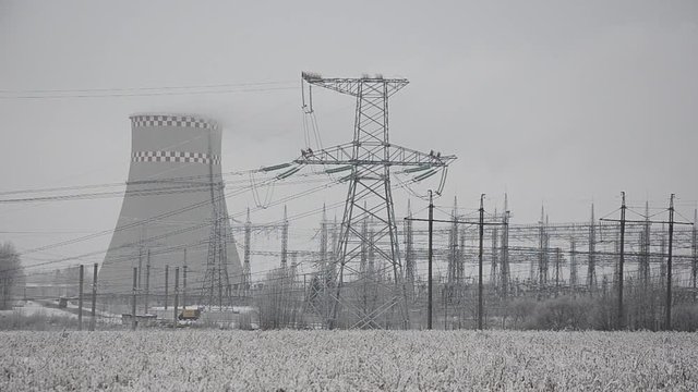 Power lines in the snow. Cogeneration plant in a strong blizzard