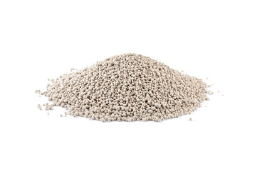 Heap of composite mineral fertilizers, isolated on white