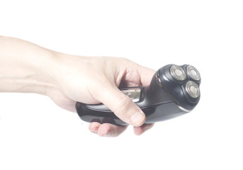 Male hand holding electric razor shaver