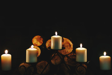 Fototapeta na wymiar Burning in the dark candles