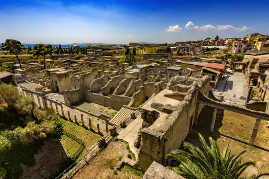 Italy. Ruins of Herculaneum (UNESCO World Heritage Site) - general view. There are the Palestra in the foreground and Decumanus Maximus in the right