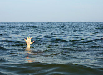 hand of the person seeks help while he is drowning
