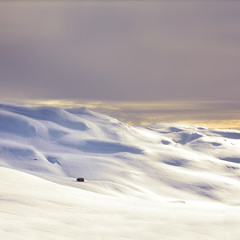Small house in winter nature. Photo with edit space.