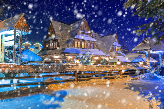 Wooden Architecture Of Zakopane On A Cold Winter Night With Falling Snow, Poland