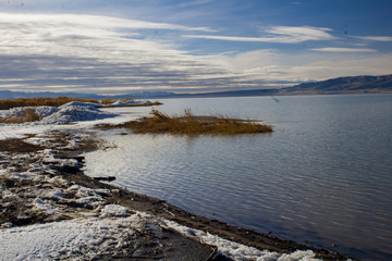 1/27/2018-Benjamin, Utah/USA- Ice sheets stacked along the edge of Utah Lake creating a tranquil feeling