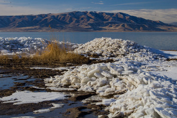 1/27/2018-Benjamin, Utah/USA- Ice sheets stacked along the edge of Utah Lake creating a tranquil feeling