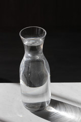 A glass water jug
