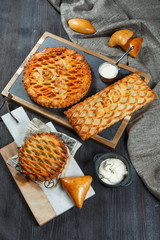 Assorted homemade rustic american style apple, berry, chocolate and lemon meringue pies