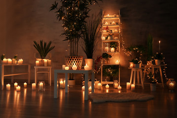 Burning candles as decor in room interior