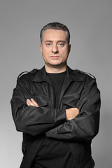 Obraz premium Male security guard on grey background