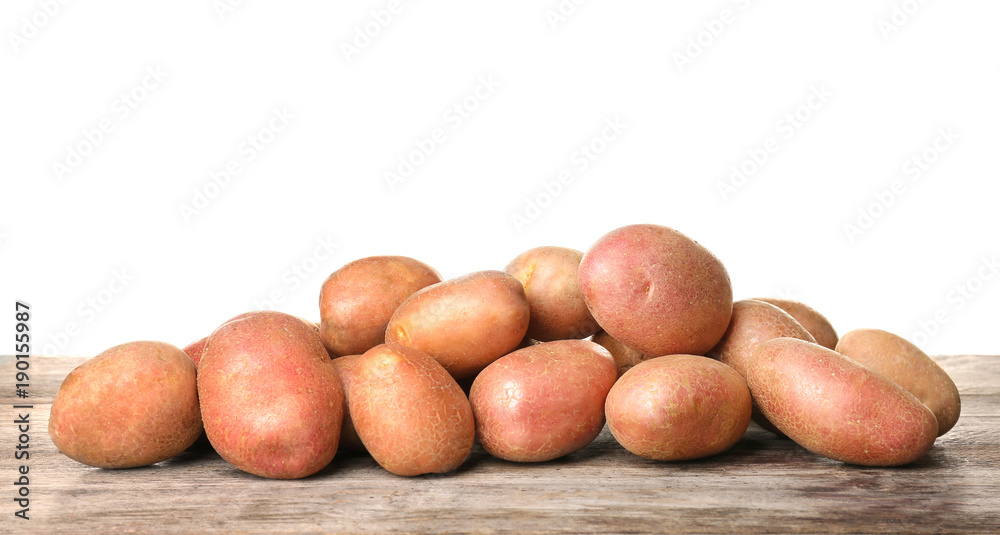 Sticker heap of raw potatoes on white background