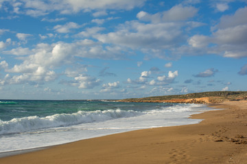 View of the waves breaking on a sandy long seashore. Akamas Peninsula, , Cyprus
