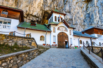Ialomitei cave, Bucegi mountains, Saints Peter and Paul Church at the entrance. An orthodox...