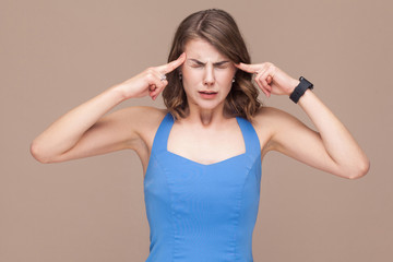 Business woman have headache or migraine at work