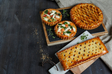 Assorted homemade rustic american style apple, berry, chocolate and lemon meringue pies