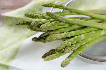 Fresh raw green asparagus ready to cook