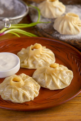 Uzbek manti with sour cream