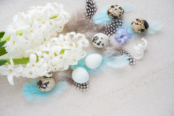 Easter eggs with flowers and feathers