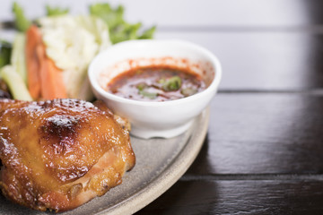 Grilled chicken served with spicy Thai tamarind sauce and fresh vegetable