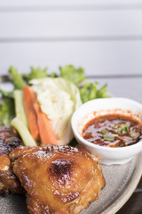Grilled chicken served with spicy Thai tamarind sauce and fresh vegetable