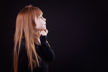 Obraz premium little blond girl looking thoughtfully aside