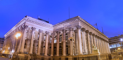 Naklejka premium The Bourse of Paris- Brongniart palace at night,Paris, France.
