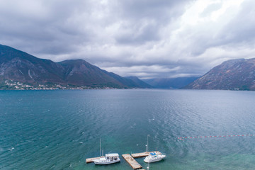 Fototapeta na wymiar Aerial view of motor boats at the pier. Montenegro.