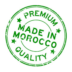 Grunge green premium quality made in Morocco round rubber seal stamp on white background