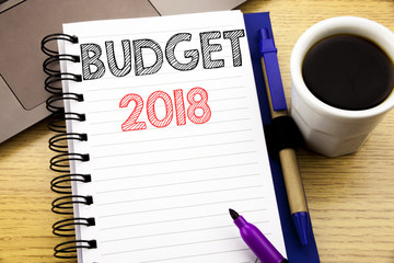 Word, writing Budget 2018. Business concept for Household budgeting accounting planning written on notebook book on the wooden background in the Office with laptop coffee