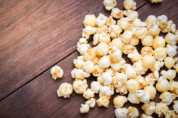 popcorn texture on a wooden table blackground
