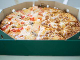 Seafood pizza in box. Delivery pizza.