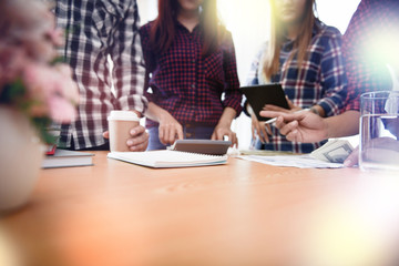 Startup business people group meeting. People group sitting on conference together and making notes. hands pointing at business document during discussion at meeting.