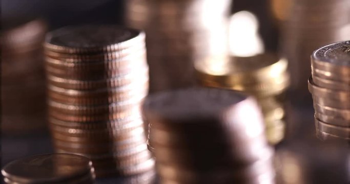 Close up money coin stacking on  the floor in dark light , business and financial for money saving or investment background concept , extremely close up and shallow DOF