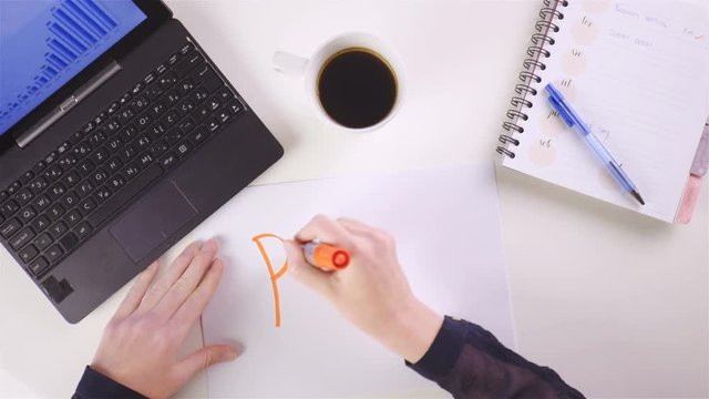 Person write PLAN on piece of paper at the office 4K
