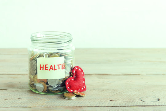 Coins in jar with Health label
