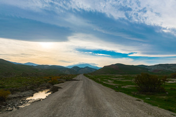 Road to mountains in the valley, mountain landscape